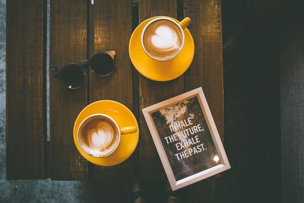 Two Cups of Coffee With Latte Art