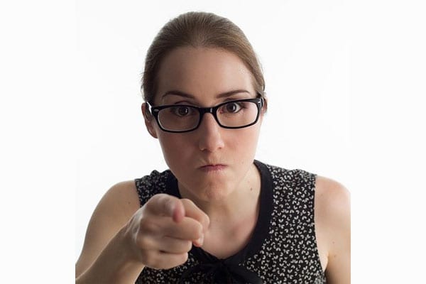 A Woman Pointing at the Camera