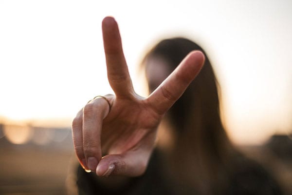 A Woman Posing With a Peace Sign